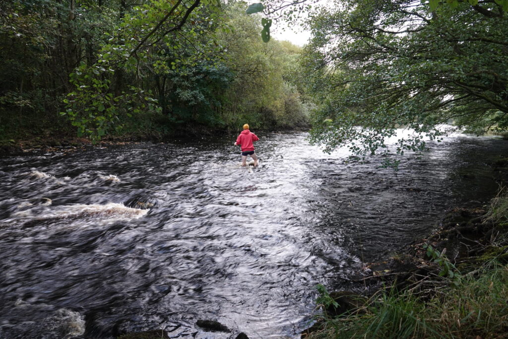 Josh fords the river to a mysterious island